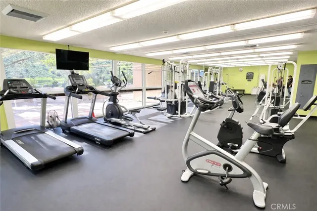 a dining room with a wooden table and chairs
