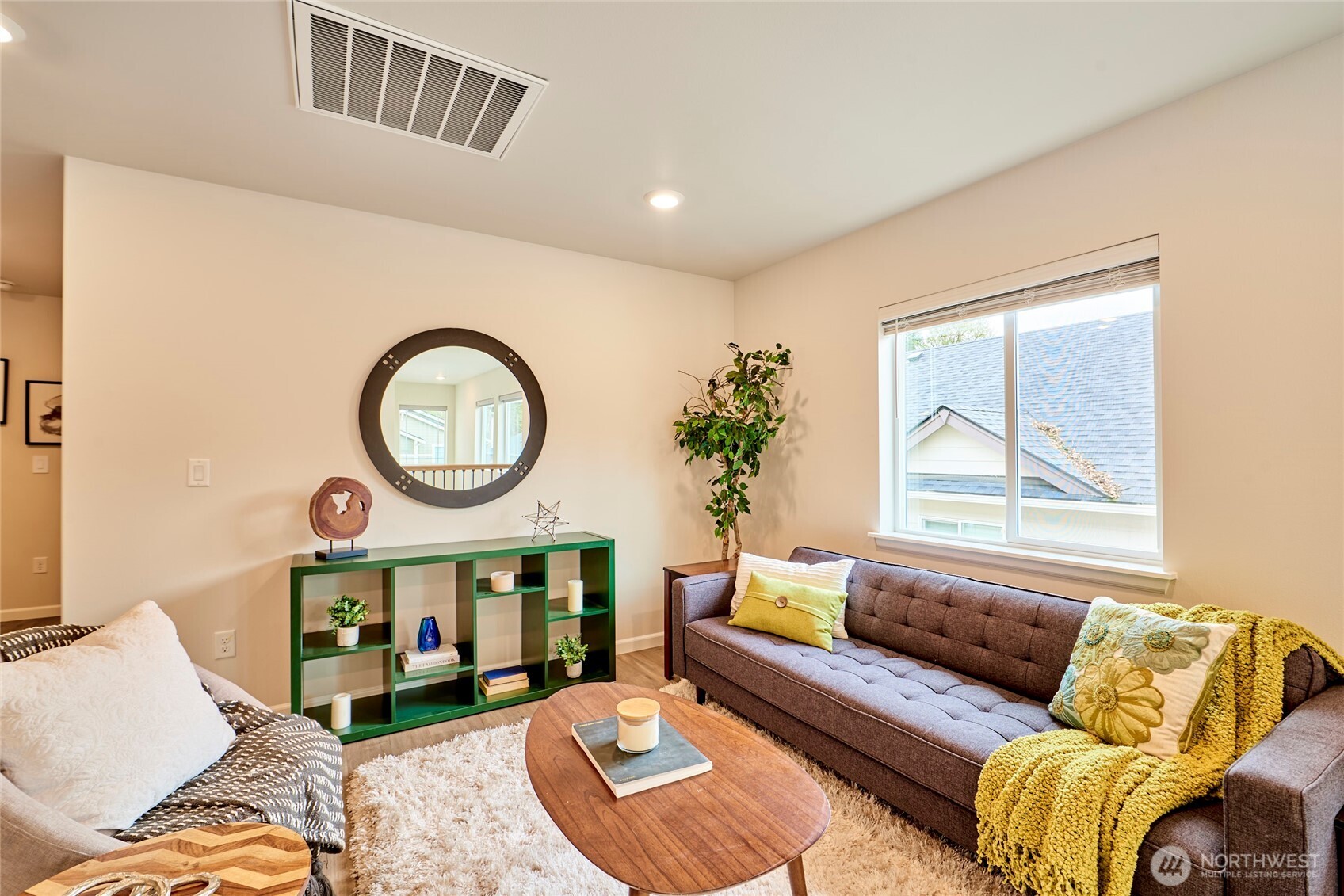 4022 233rd Street Southeast Bothell, WA 98021 - Photo 15 of 40 a living room with furniture a rug and a window