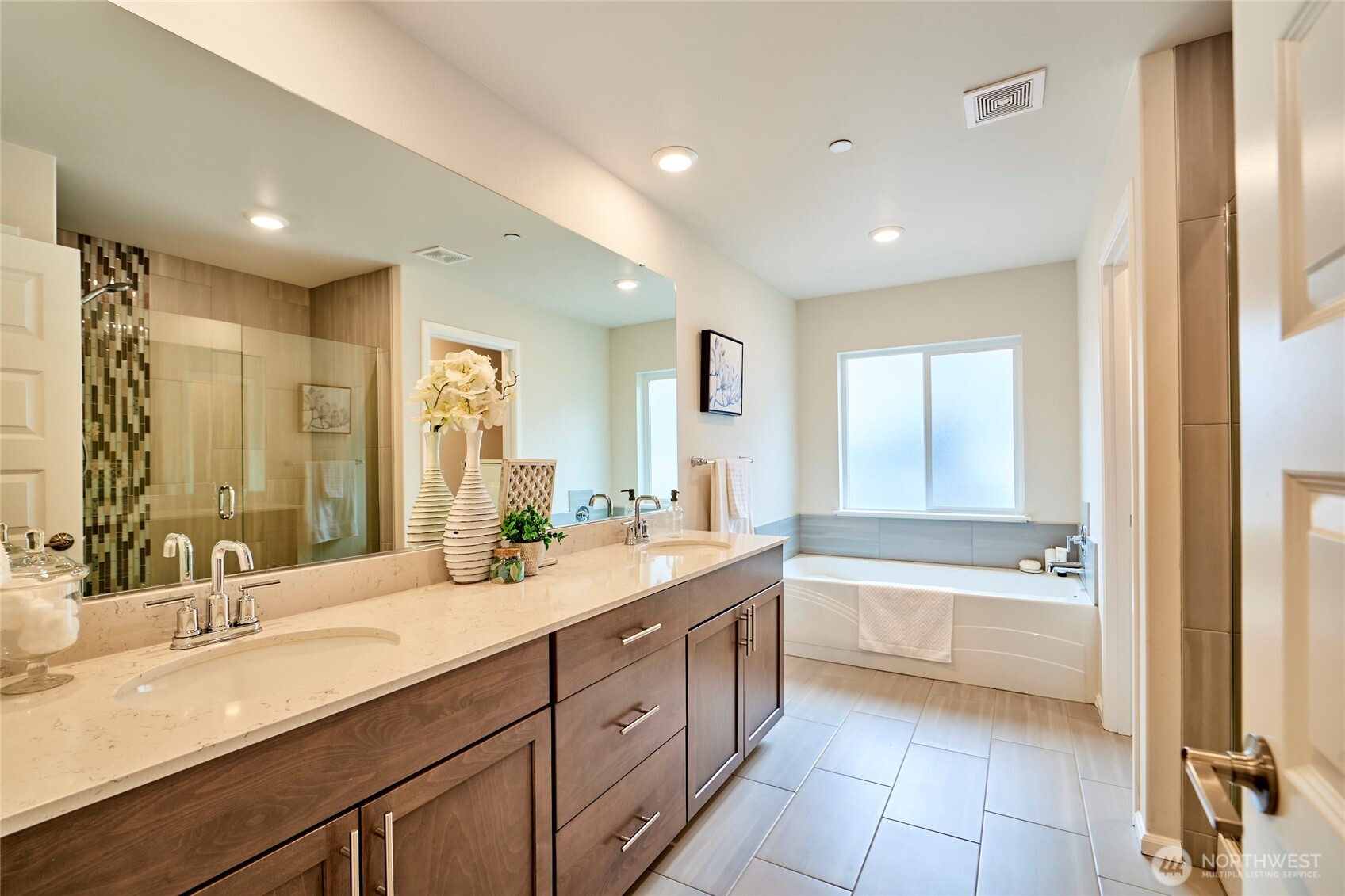 4022 233rd Street Southeast Bothell, WA 98021 - Photo 19 of 40 a bathroom with a granite countertop sink mirror bathtub and double