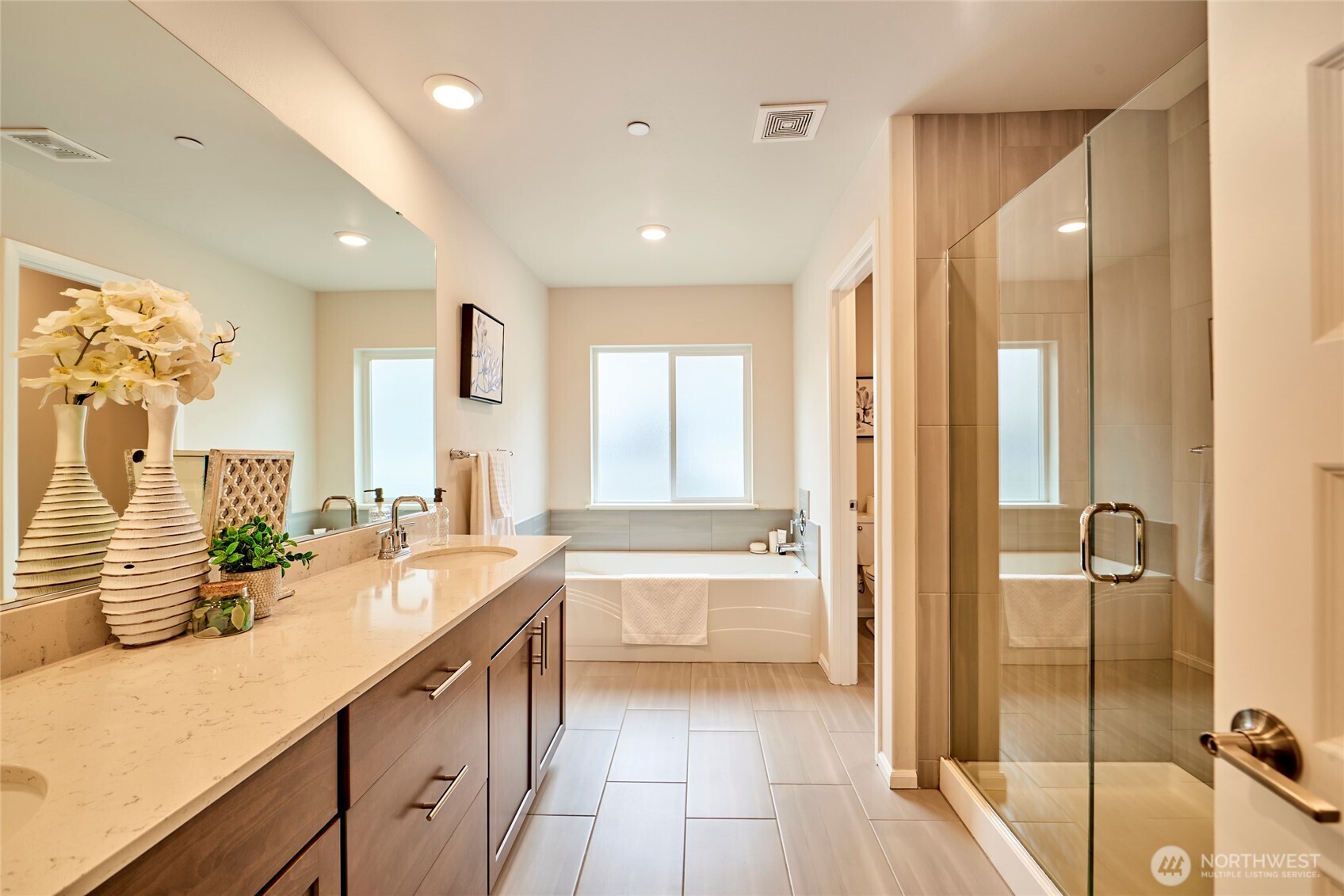 4022 233rd Street Southeast Bothell, WA 98021 - Photo 20 of 40 a spacious bathroom with a tub sink shower and mirror