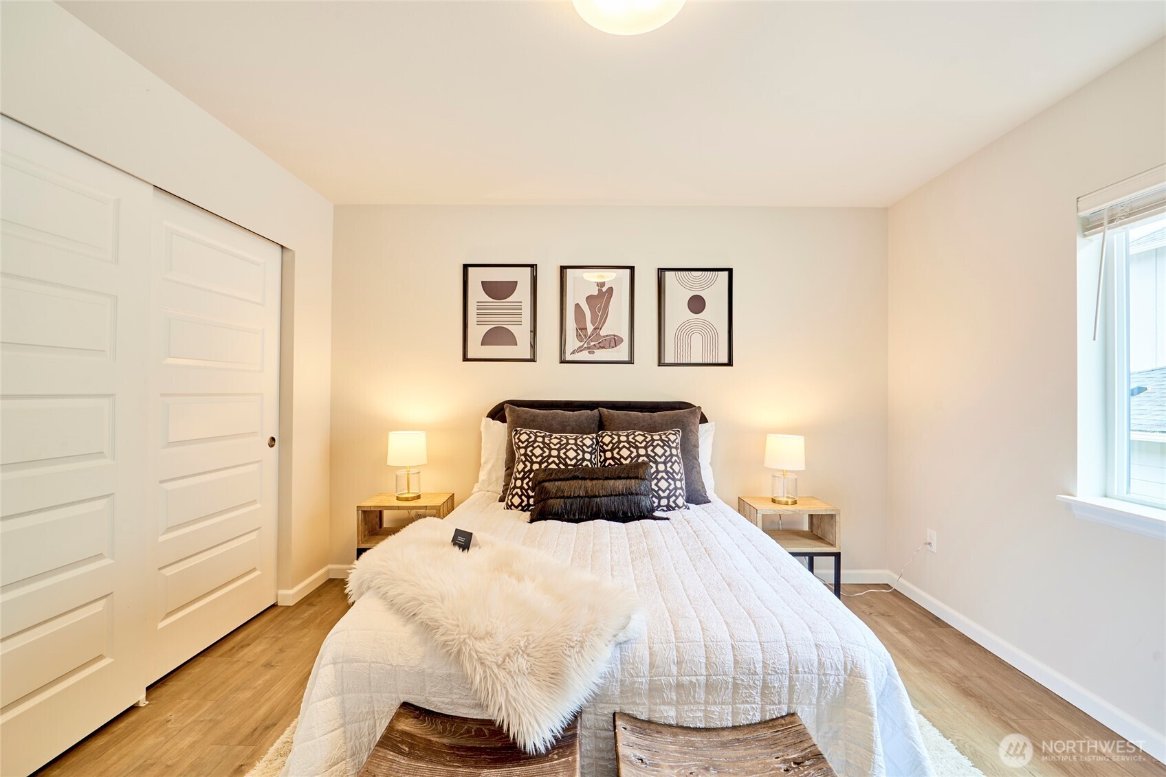 4022 233rd Street Southeast Bothell, WA 98021 - Photo 23 of 40 a bedroom with a bed and wooden floor