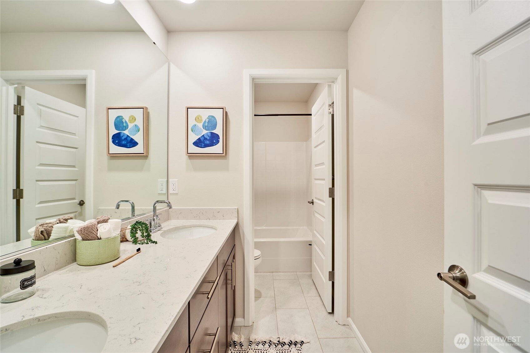 4022 233rd Street Southeast Bothell, WA 98021 - Photo 25 of 40 a bathroom with a sink a mirror and a shower