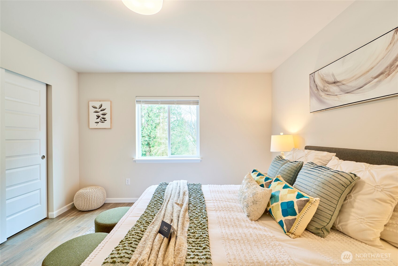 4022 233rd Street Southeast Bothell, WA 98021 - Photo 30 of 40 a bedroom with a bed and wooden floor