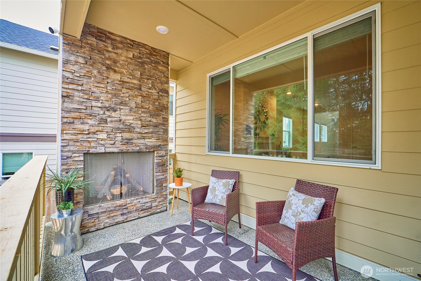 4022 233rd Street Southeast Bothell, WA 98021 - Photo 33 of 40 a outdoor living space with furniture and a fireplace