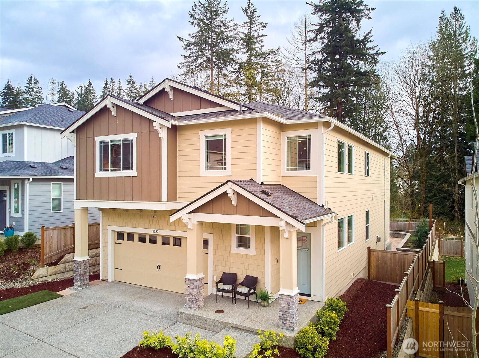 4022 233rd Street Southeast Bothell, WA 98021 - Photo 39 of 40 a front view of a house with yard porch and glass windows