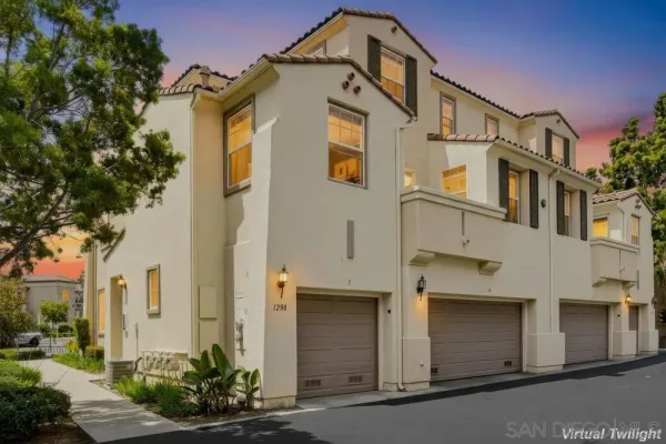 a front view of a house with a garage