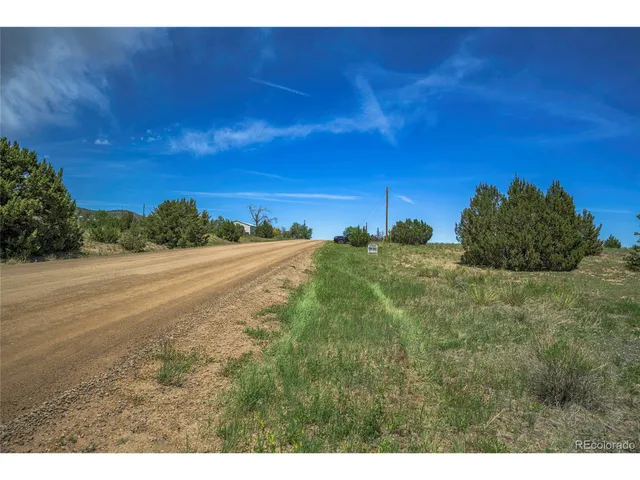 a view of a field with an ocean