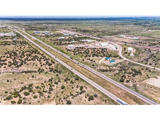an aerial view of beach and city