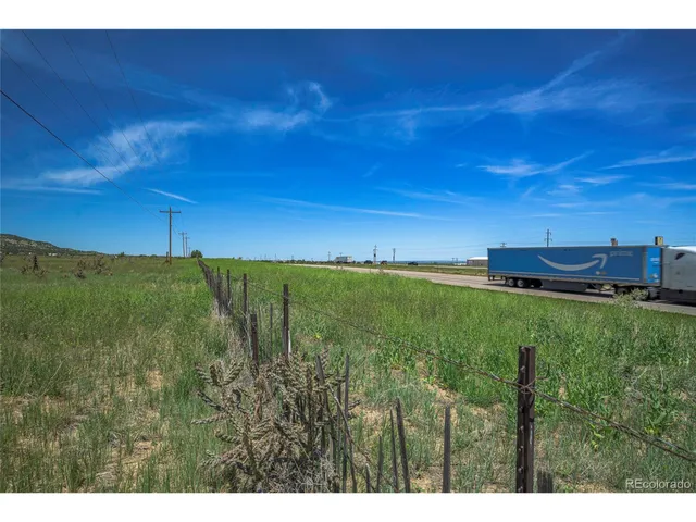 a view of a big yard with a house in background