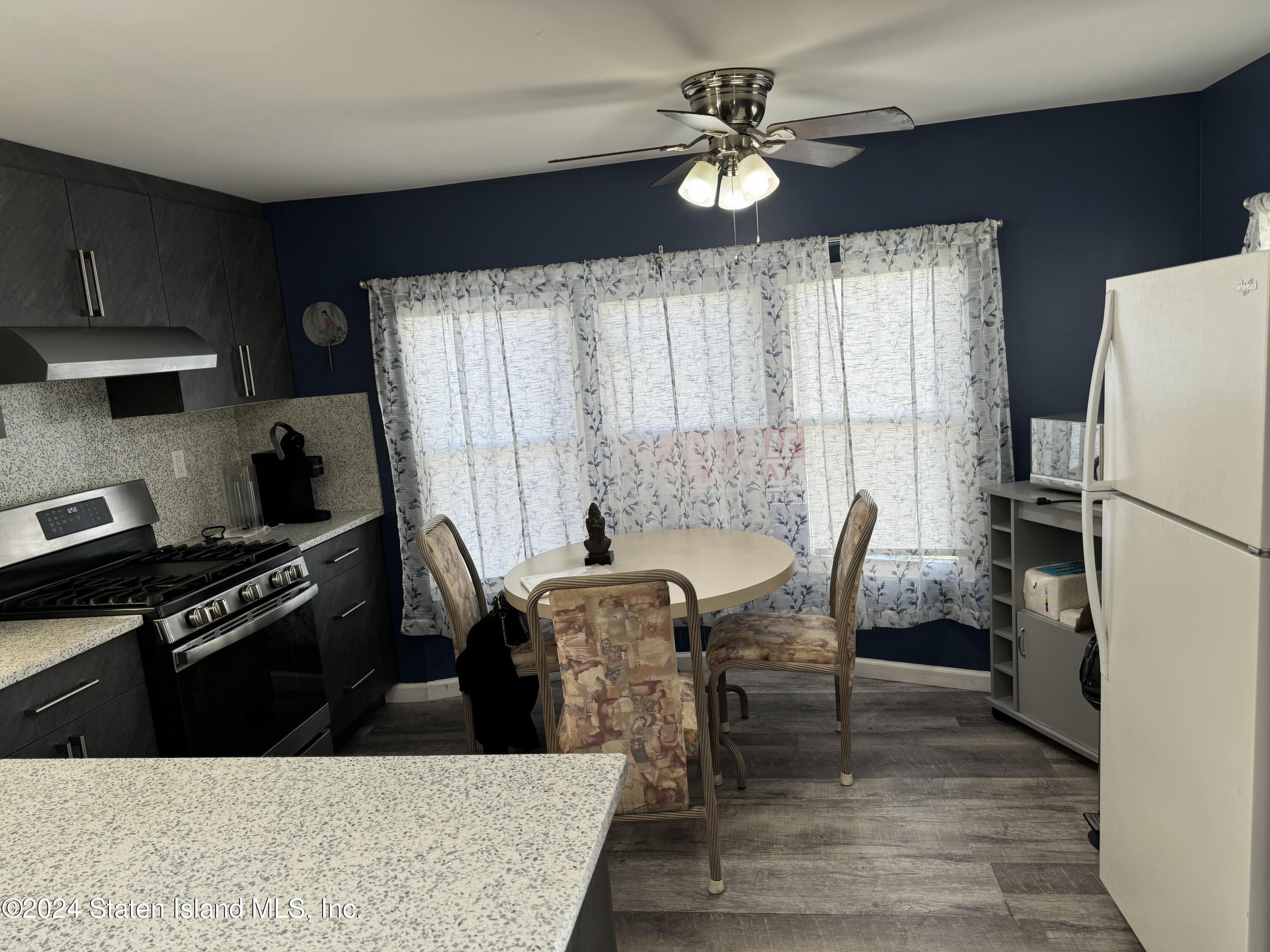 2701 Goethals Road North, Unit D11 Staten Island, NY 10303 - Photo 6 of 9 a dining room with furniture and window