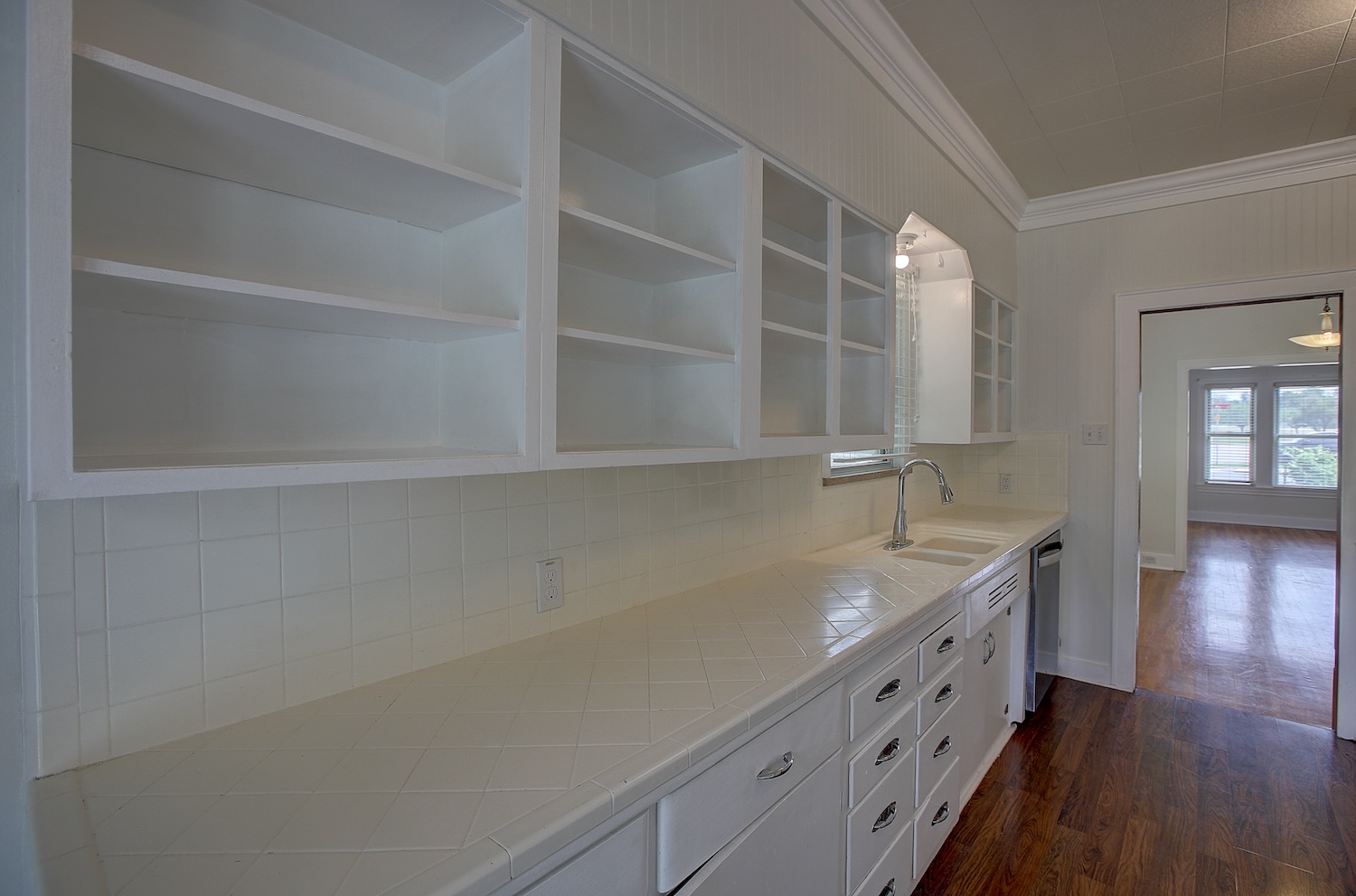 1708 Olive Street Georgetown, TX 78626 - Photo 2 of 40 a kitchen with a sink and cabinets