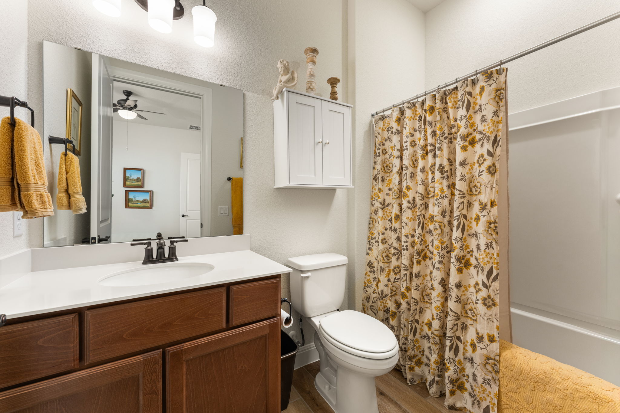 112 Telegraph Lane Georgetown, TX 78633 - Photo 19 of 35 Ensuite bathroom for guest bedroom #2. Features Miami White Quartz counters, American Beech-Chateau cabinets, and upgraded oil rubbed bronze Dartmoor faucet and oil rubbed bronze bath hardware and fixtures. There are also upgraded Aubrey Olde Bronze light fixtures.