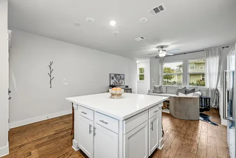 a kitchen that has a table and chairs in it