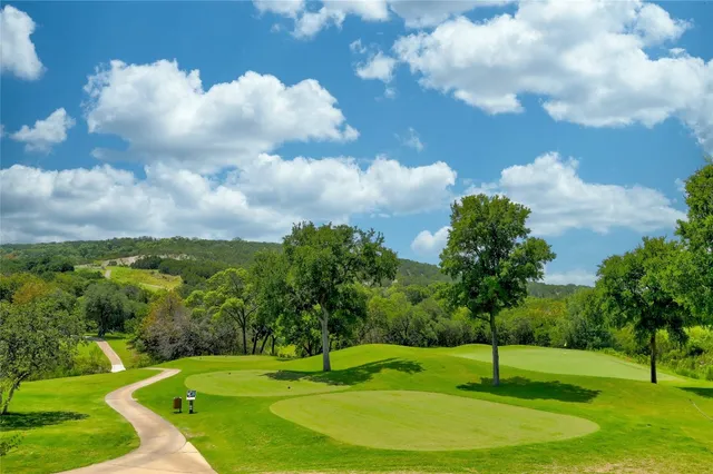 a view of a golf course with a fountain