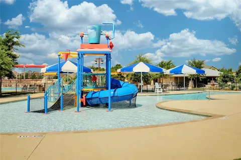 a childrens park with lots of swings and slides