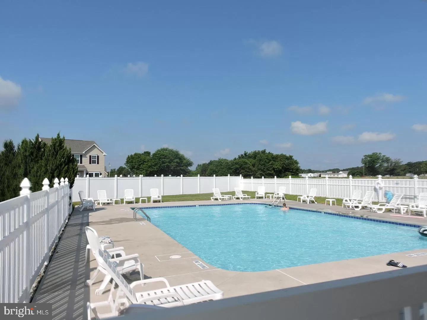 108 Bobbys Branch Road Millsboro, DE 19966 - Photo 11 of 13 a view of swimming pool and outdoor seating