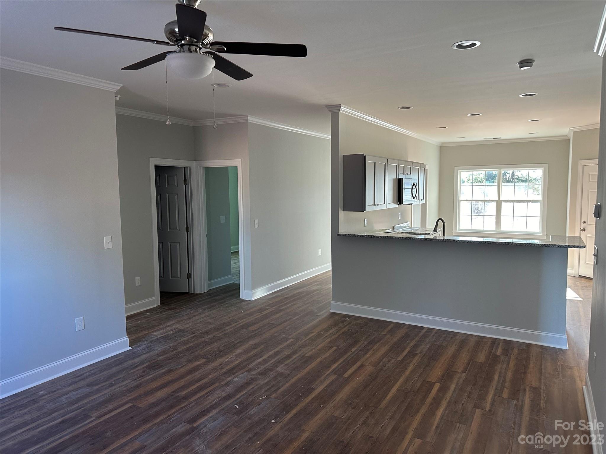 3807 Red Doc Road Lancaster, SC 29720 - Photo 4 of 7 a view of empty room with wooden floor and fan