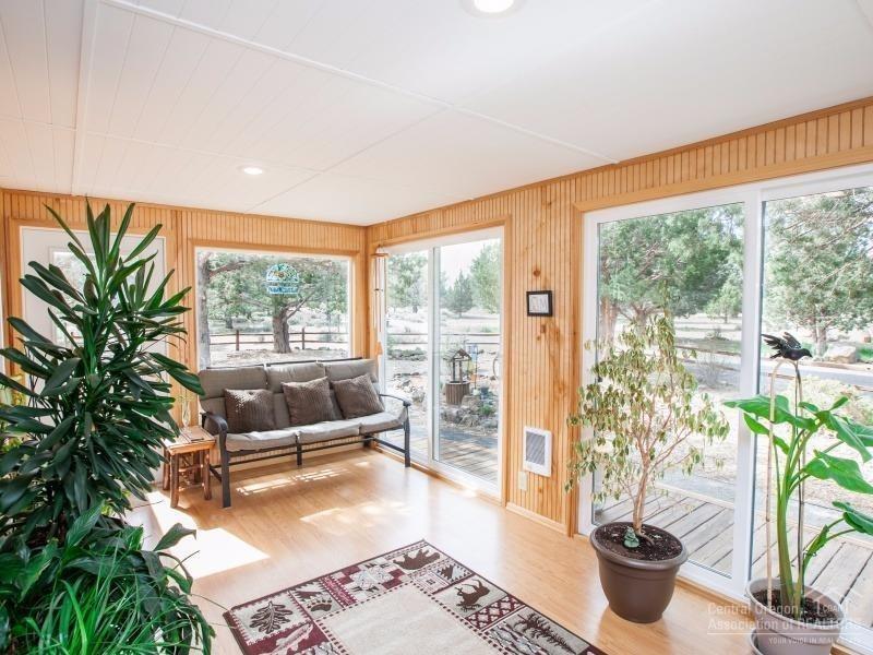 22962 Rickard Road Bend, OR 97702 - Photo 9 of 25 The sunroom, which was added by the curr