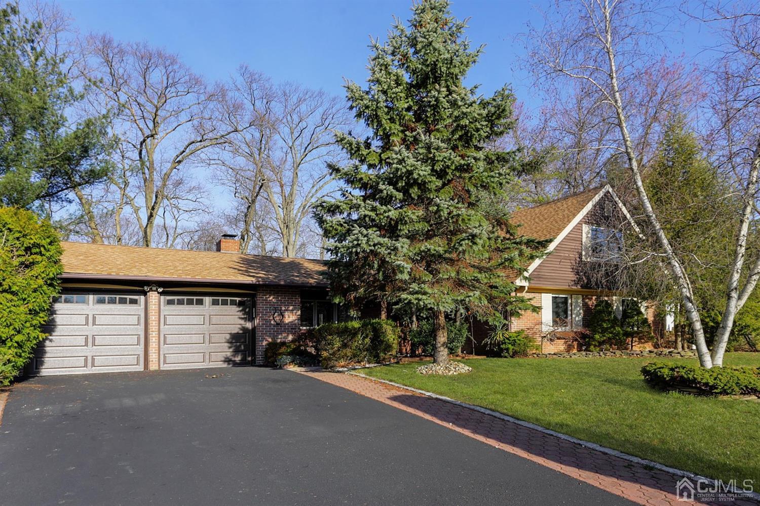 75 Lakeridge Drive Old Bridge, NJ 07747 - Photo 1 of 26 a front view of a house with a garden