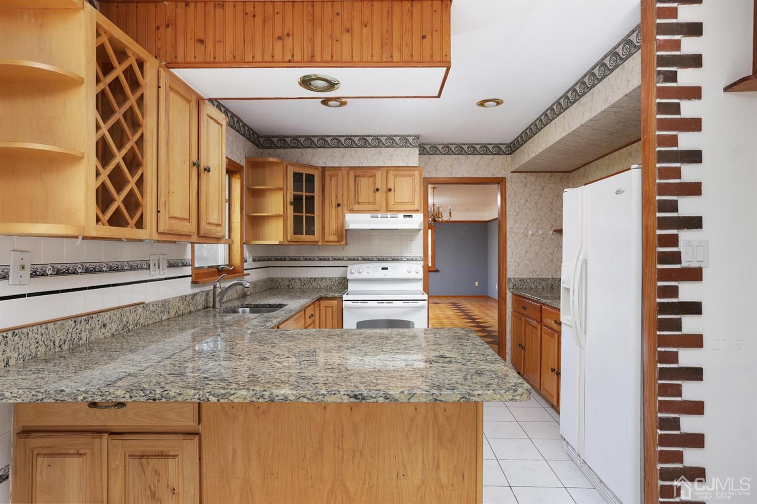 75 Lakeridge Drive Old Bridge, NJ 07747 - Photo 13 of 26 a kitchen with sink and refrigerator