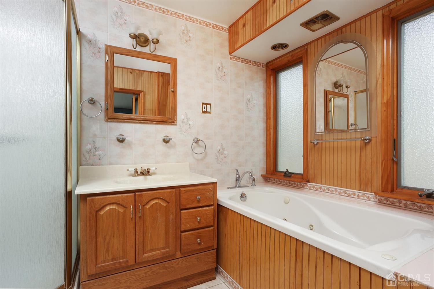 75 Lakeridge Drive Old Bridge, NJ 07747 - Photo 17 of 26 a spacious bathroom with a granite countertop sink and a mirror