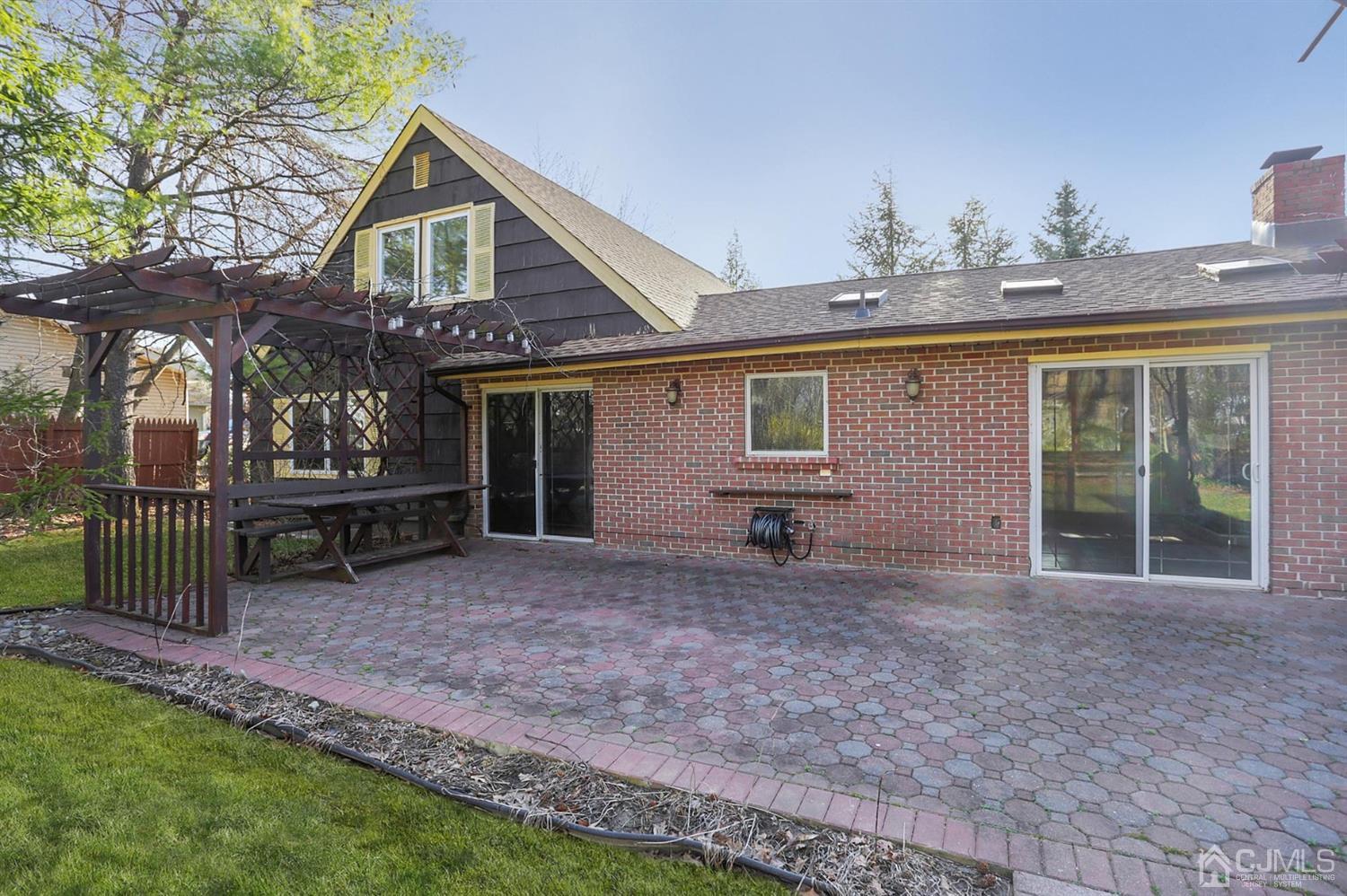 75 Lakeridge Drive Old Bridge, NJ 07747 - Photo 22 of 26 a view of a house with a yard and wooden fence