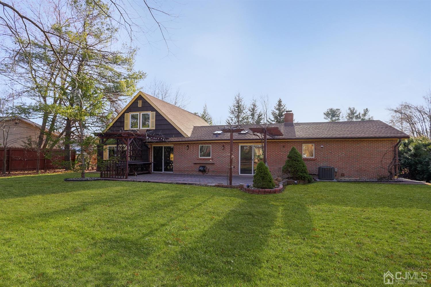 75 Lakeridge Drive Old Bridge, NJ 07747 - Photo 26 of 26 a front view of a house with a yard