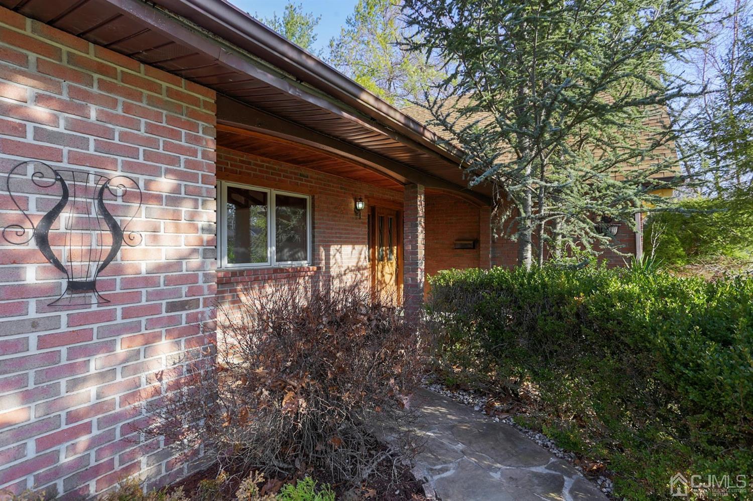 75 Lakeridge Drive Old Bridge, NJ 07747 - Photo 4 of 26 a front view of a house with garden