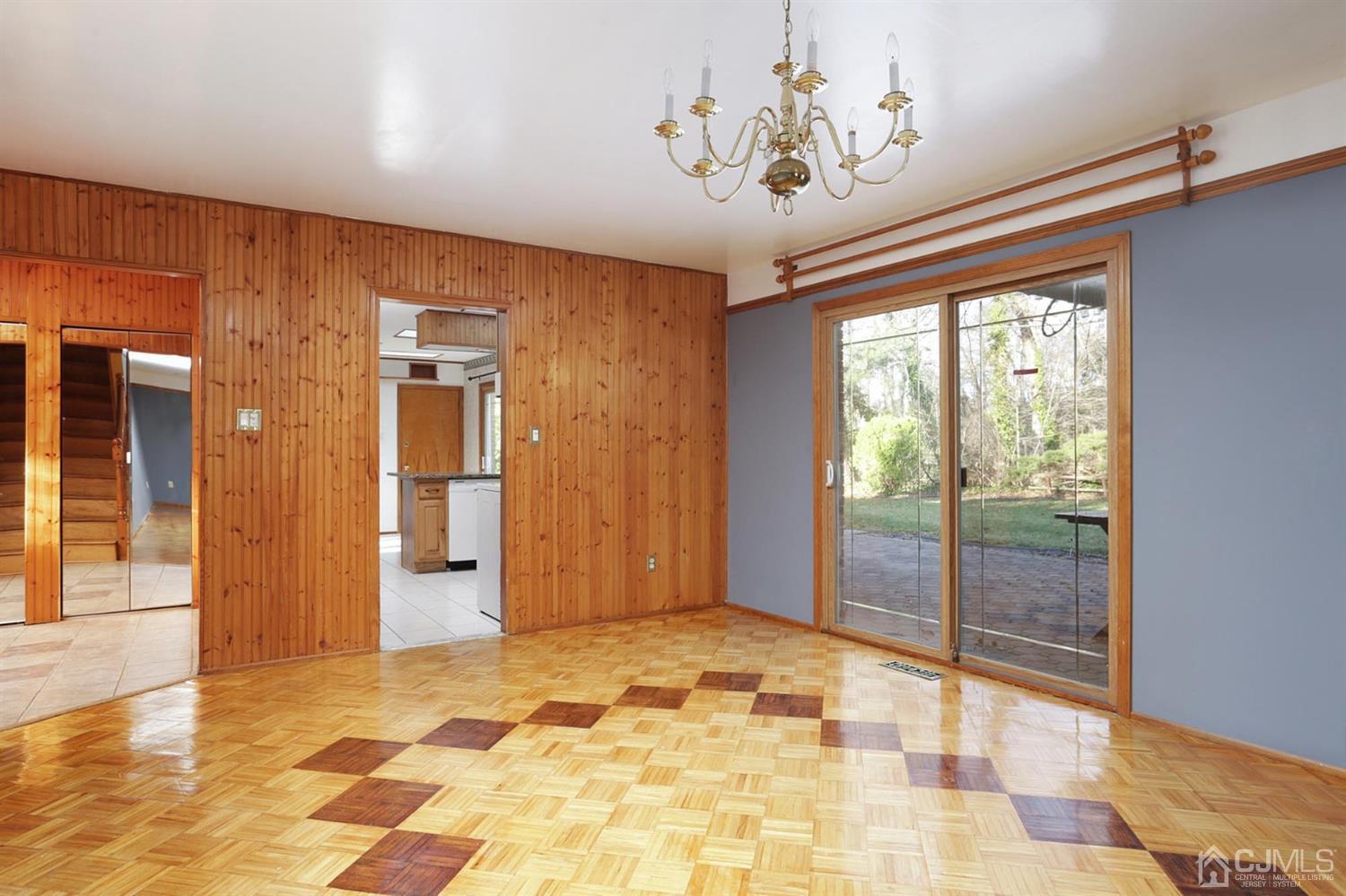75 Lakeridge Drive Old Bridge, NJ 07747 - Photo 9 of 26 a view of a hallway with a chandelier
