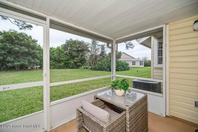 a view of a patio with a yard