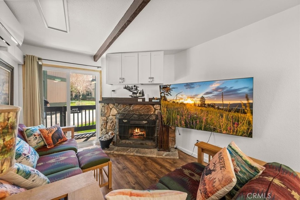 760 Bluejay Road, Unit 1 Big Bear Lake, CA 92315 - Photo 11 of 29 a living room with furniture and a fireplace
