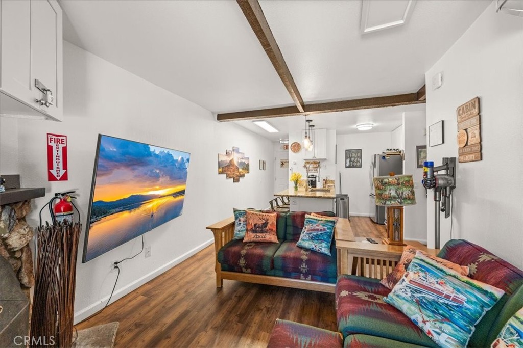 760 Bluejay Road, Unit 1 Big Bear Lake, CA 92315 - Photo 12 of 29 a living room with furniture and a flat screen tv