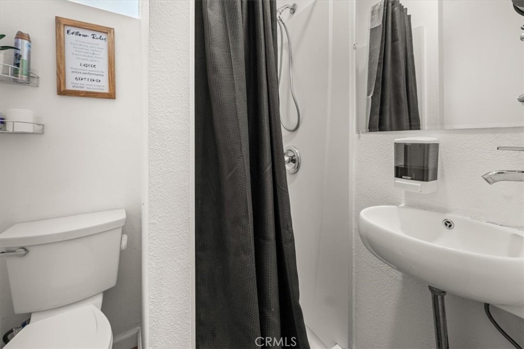 760 Bluejay Road, Unit 1 Big Bear Lake, CA 92315 - Photo 15 of 29 a bathroom with a sink and a toilet