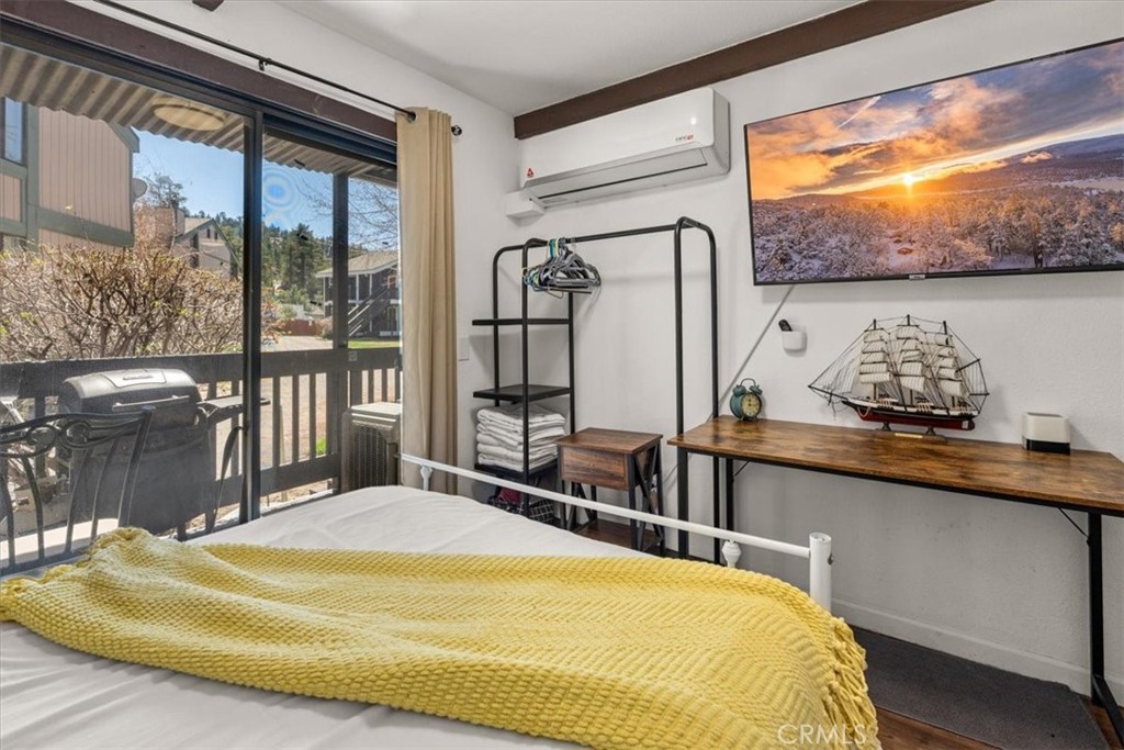 760 Bluejay Road, Unit 1 Big Bear Lake, CA 92315 - Photo 17 of 29 a bed sitting in a bedroom next to a window