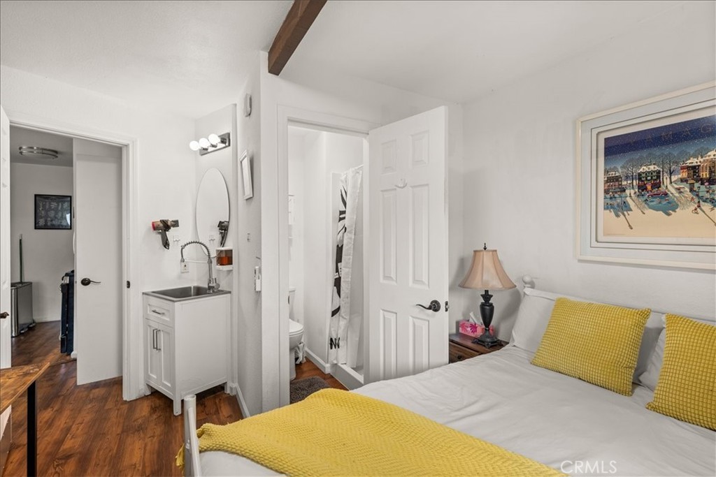 760 Bluejay Road, Unit 1 Big Bear Lake, CA 92315 - Photo 19 of 29 a bedroom with a bed and a flat screen tv