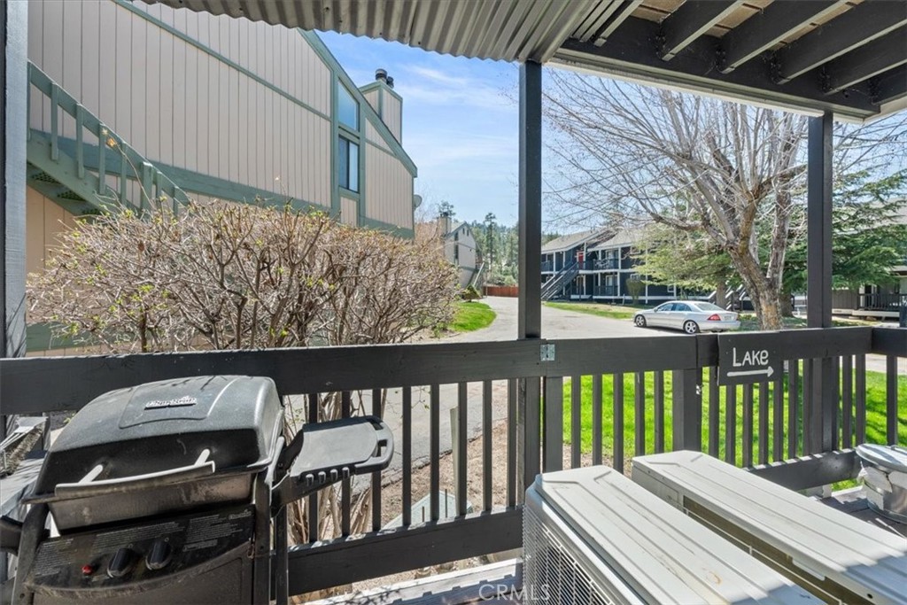 760 Bluejay Road, Unit 1 Big Bear Lake, CA 92315 - Photo 22 of 29 a view of a balcony with wooden floor