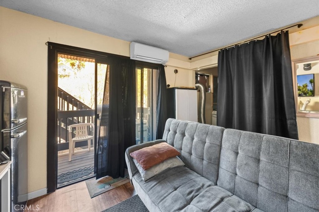760 Bluejay Road, Unit 1 Big Bear Lake, CA 92315 - Photo 26 of 29 a living room with furniture and a window