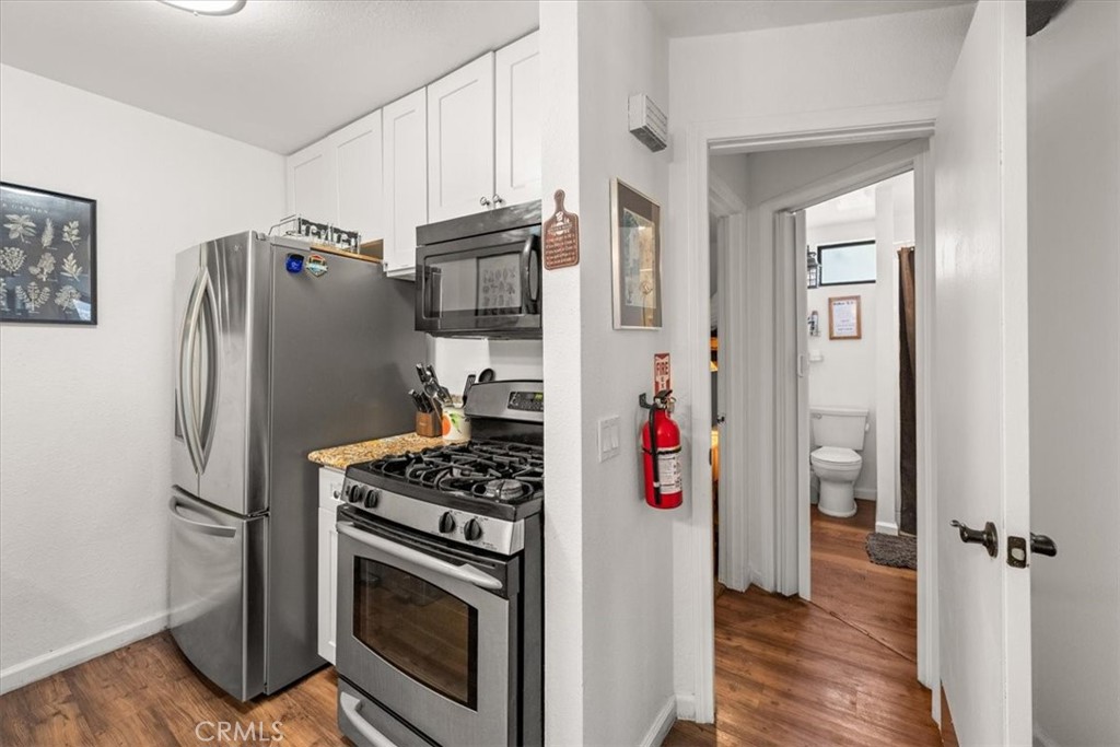 760 Bluejay Road, Unit 1 Big Bear Lake, CA 92315 - Photo 8 of 29 a kitchen with stainless steel appliances a refrigerator and a stove