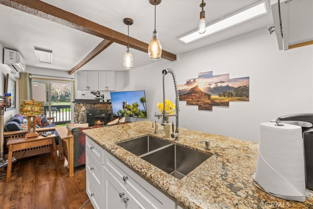 760 Bluejay Road, Unit 1 Big Bear Lake, CA 92315 - Photo 9 of 29 a kitchen with sink refrigerator and cabinets