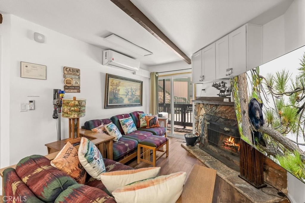 760 Bluejay Road, Unit 1 Big Bear Lake, CA 92315 - Photo 10 of 29 a living room with furniture and a flat screen tv