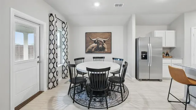 a view of a dining room with furniture