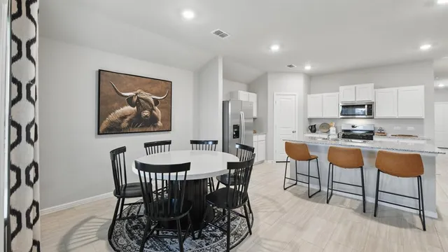 a kitchen with a sink stove and wooden cabinets