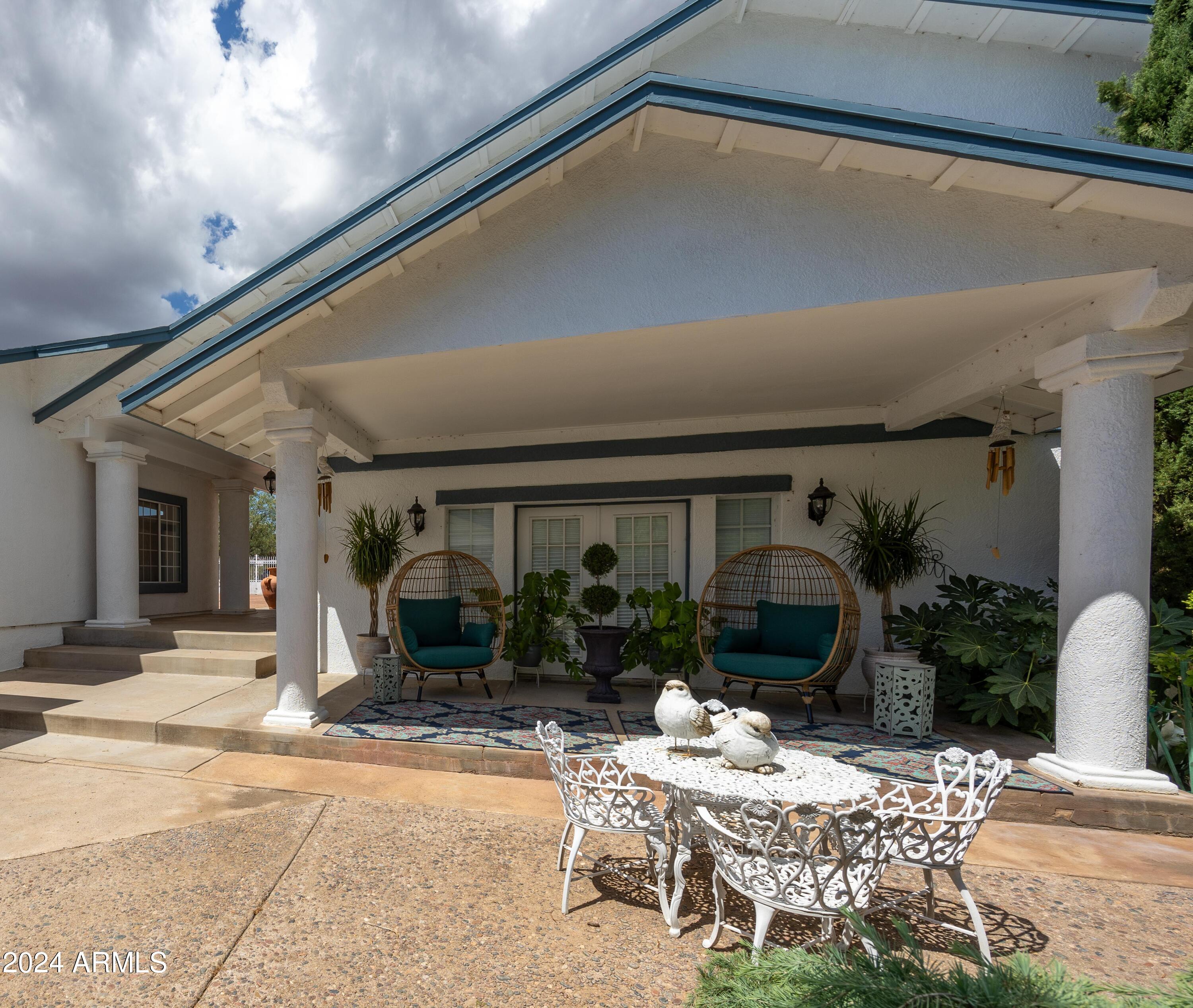 2204 North Maple Avenue Huachuca City, AZ 85616 - Photo 16 of 65 a patio with a table and chairs
