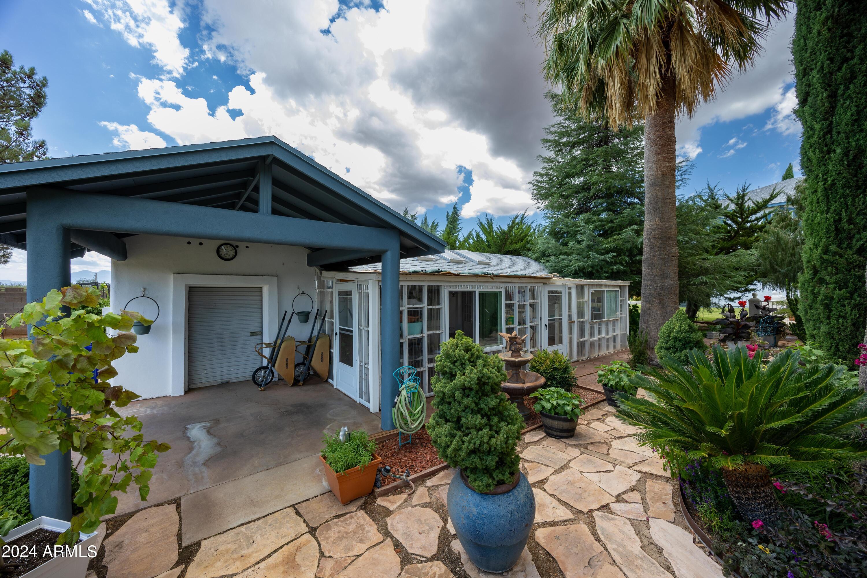 2204 North Maple Avenue Huachuca City, AZ 85616 - Photo 22 of 65 a front view of a house with a garden