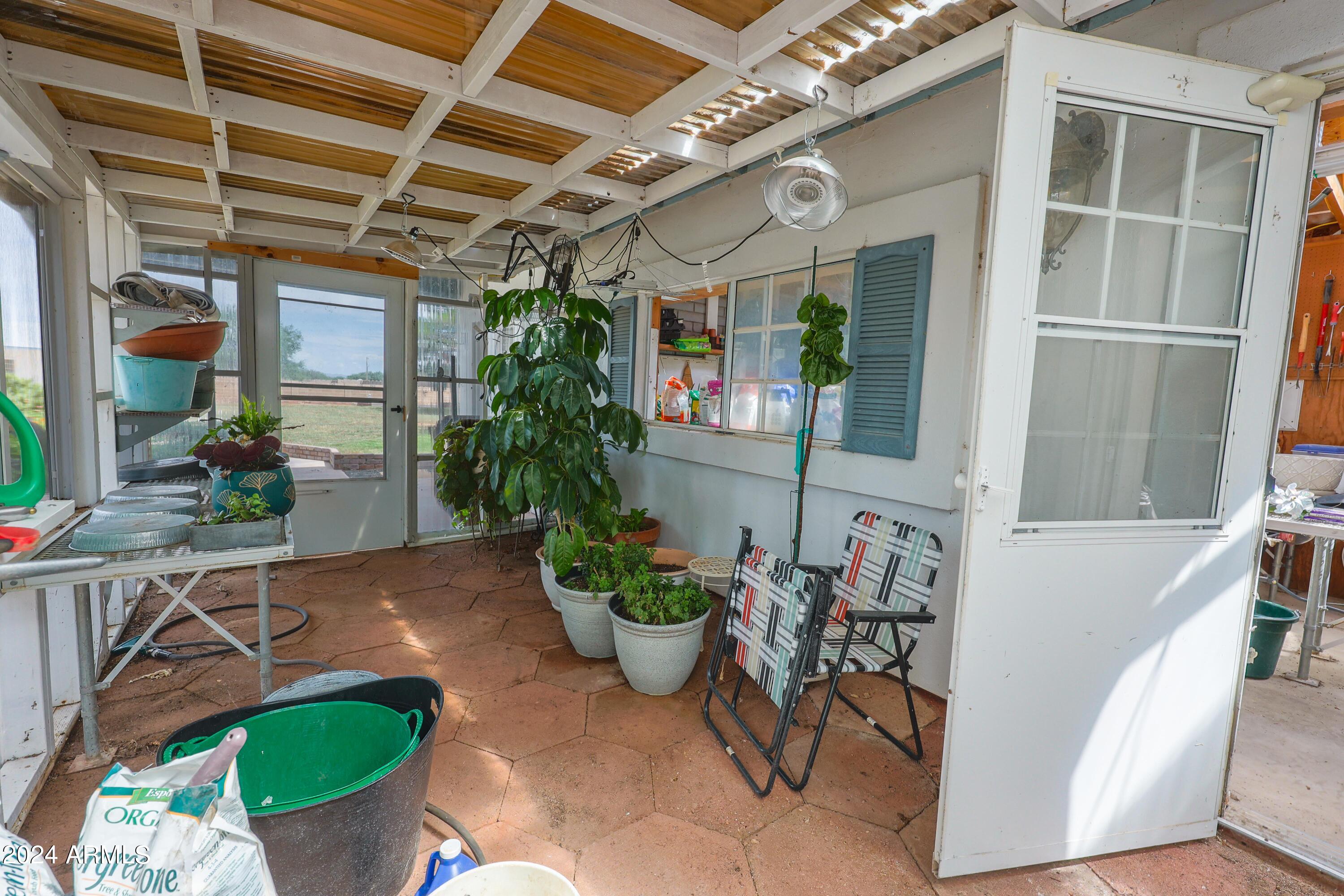 2204 North Maple Avenue Huachuca City, AZ 85616 - Photo 23 of 65 a view of a porch with chairs and potted plants