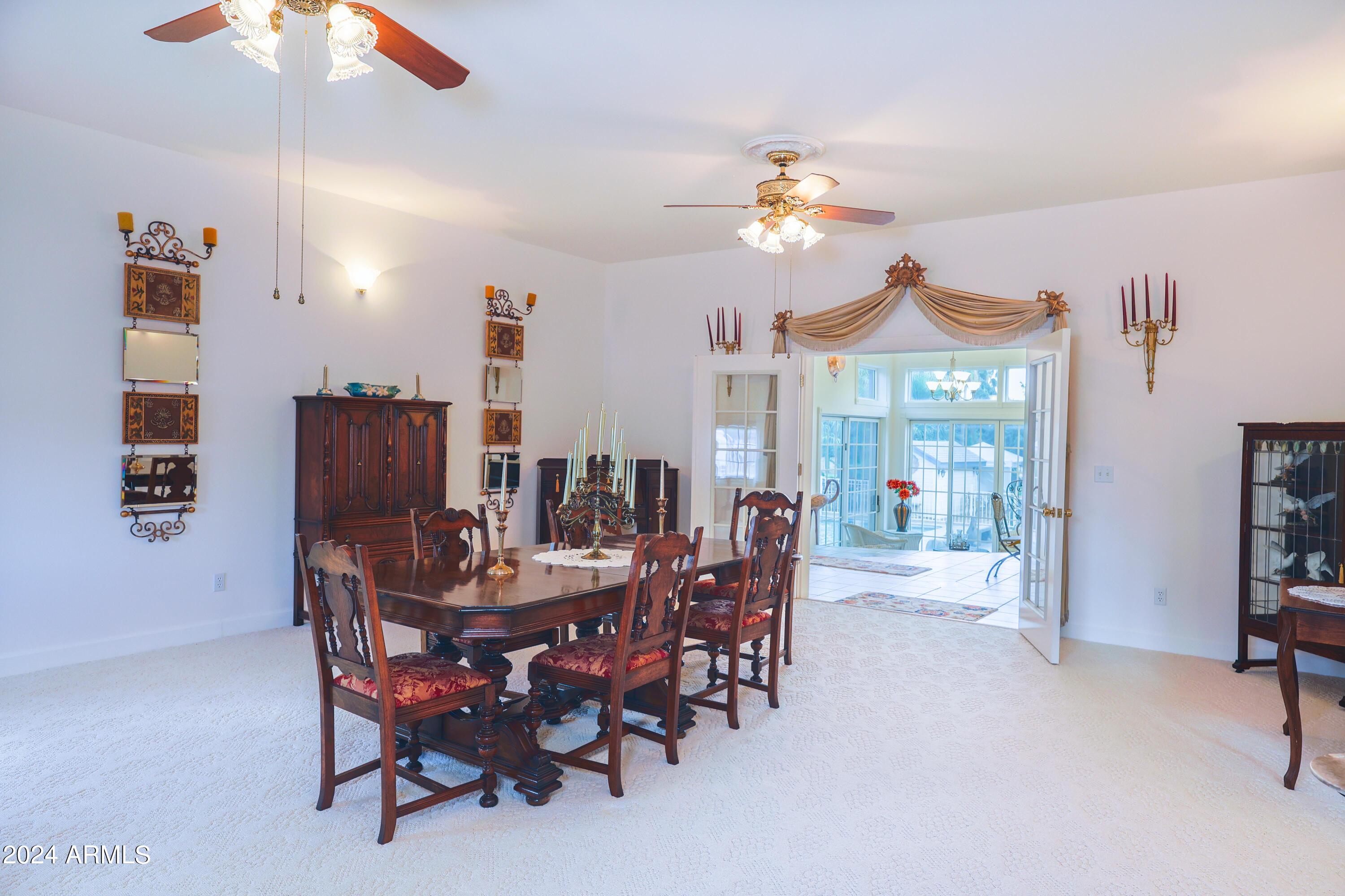 2204 North Maple Avenue Huachuca City, AZ 85616 - Photo 29 of 65 a view of a dining room with furniture and chandelier