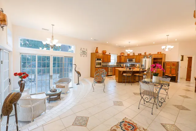a living room with a couch and a table with wooden floor