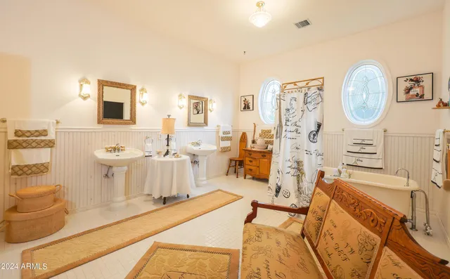 a view of a dining room with furniture and a chandelier