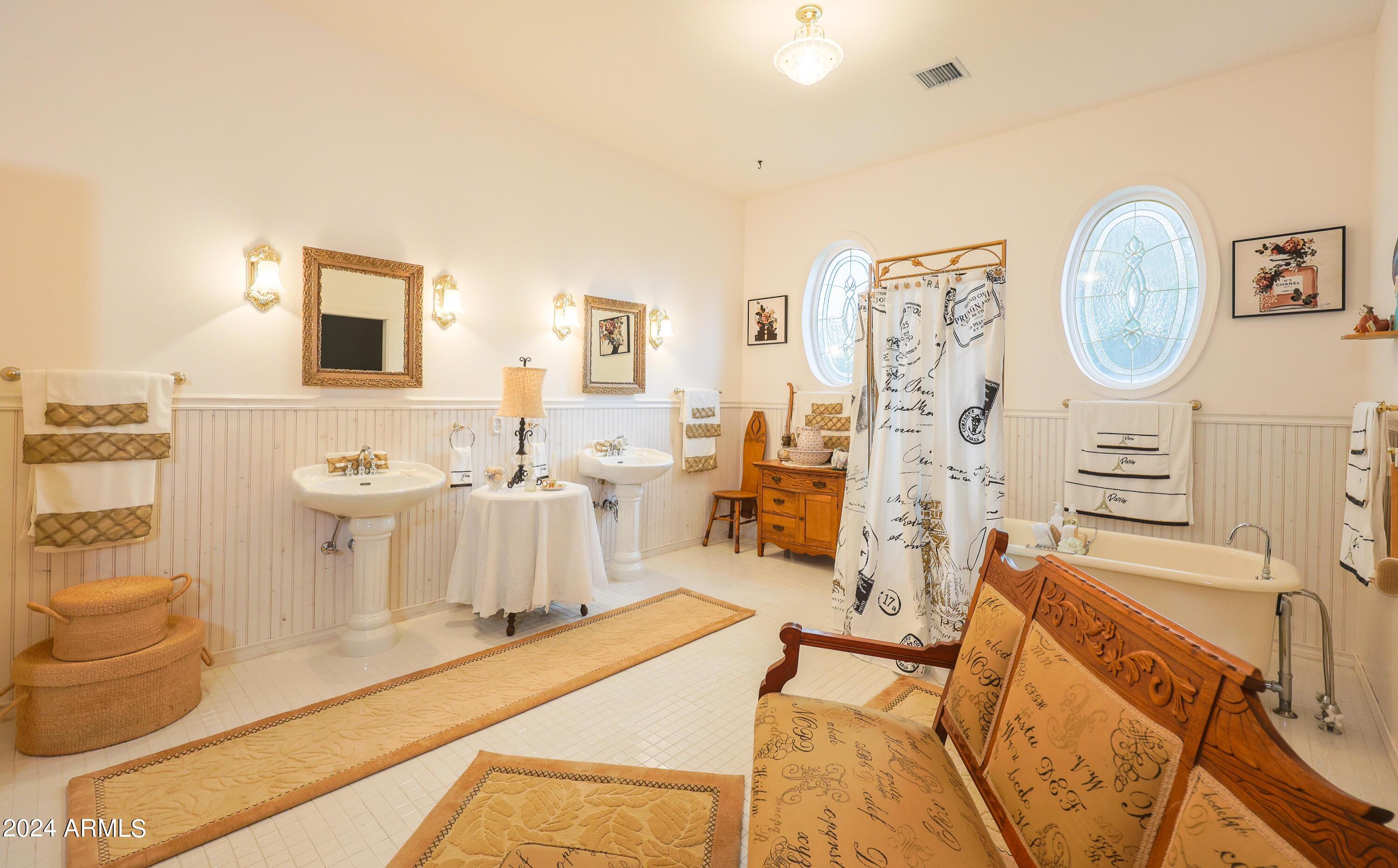 2204 North Maple Avenue Huachuca City, AZ 85616 - Photo 39 of 65 a living room with furniture a mirror and a flat screen tv