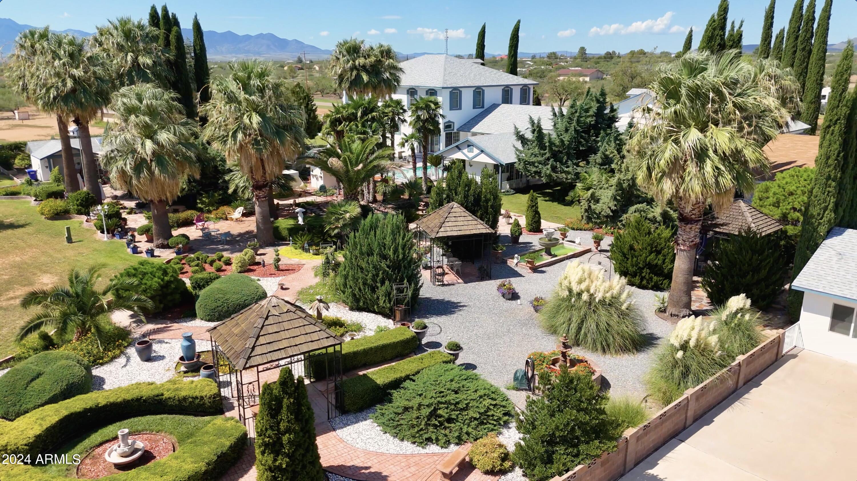 2204 North Maple Avenue Huachuca City, AZ 85616 - Photo 5 of 65 an aerial view of a house with a yard and garden